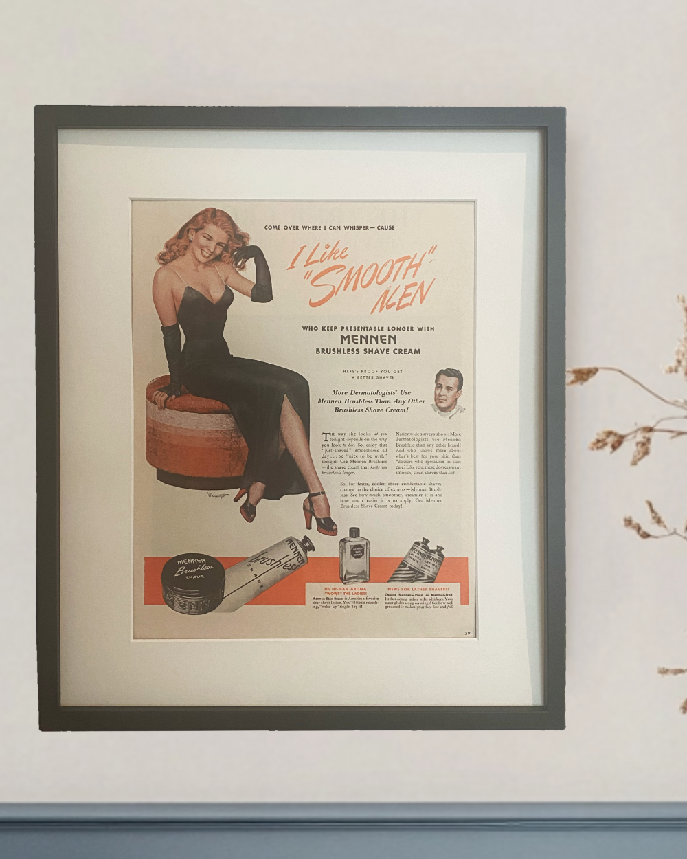Original 1946 Mennen “I Like Smooth Men” vintage advertisement in a black frame styled in a blue and white bathroom