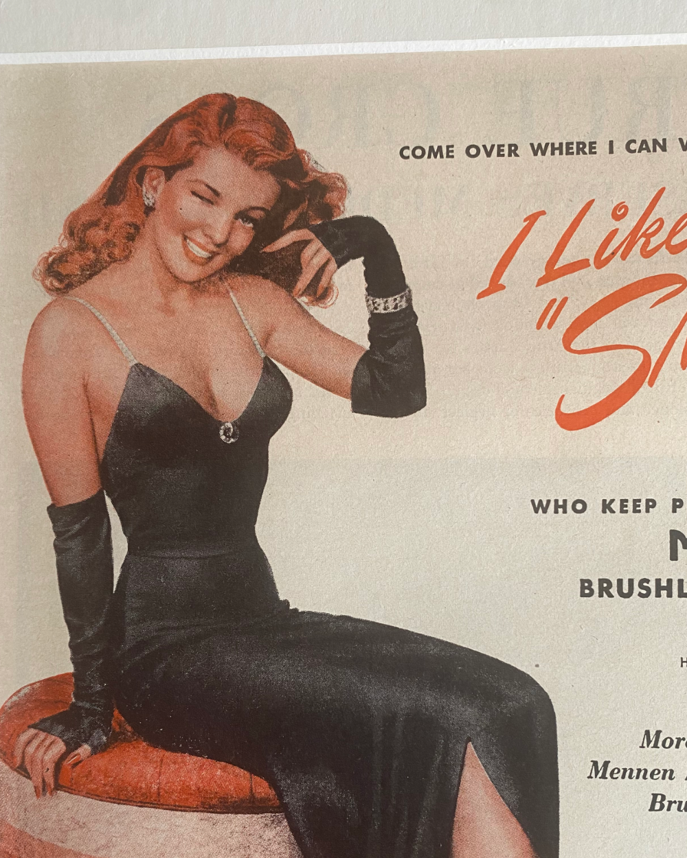 Detail of the woman in a black dress from the original 1946 Mennen “I Like Smooth Men” magazine advertisement