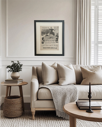 Original 1949 Sinclair Motor Oil advertisement in a black frame styled above a neutral living room sofa