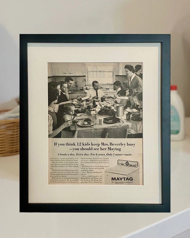 Original 1965 Maytag vintage advertisement in a matte black frame styled in a neutral laundry room