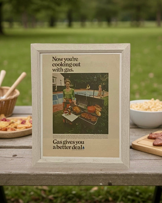 Mid-century AGA gas cooking advertisement framed in light wood, modern vintage kitchen wall art