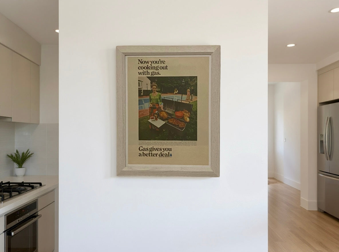 Mid-century AGA gas cooking advertisement framed in light wood, modern vintage kitchen wall art