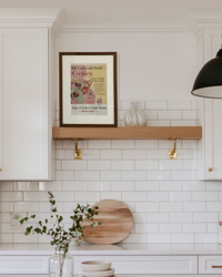 Original Betty Crocker Gold Medal Cookies vintage advertisement in a handcrafted walnut frame styled on a floating kitchen shelf.