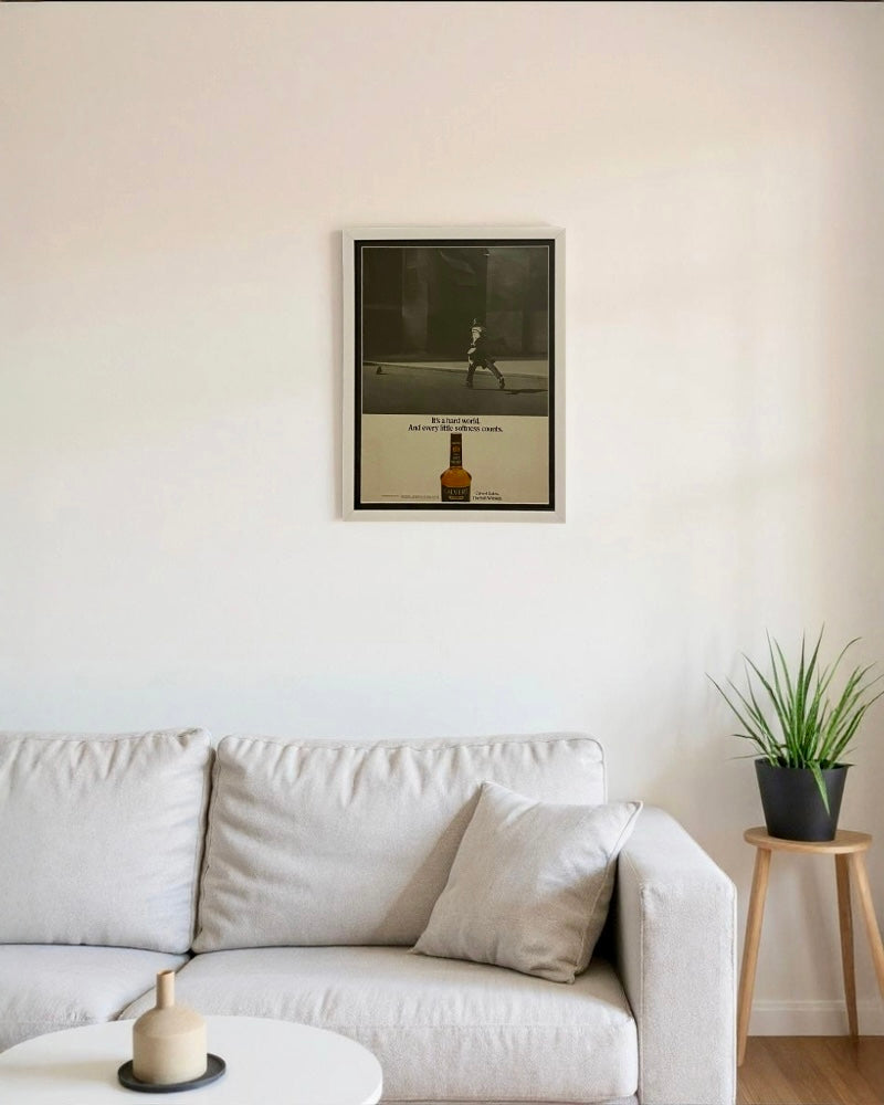 Framed vintage Calvert Extra whiskey advertisement featuring a mid-century street scene and minimalist typography