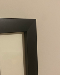 Premium solid wood matte black frame used to professionally finish the original vintage Coca-Cola advertisement