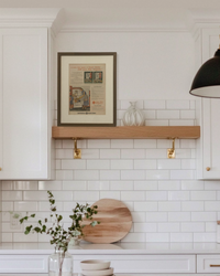 Original 1948 General Electric Space Maker Refrigerator vintage advertisement displayed on a floating kitchen shelf in a handcrafted brown wood frame.