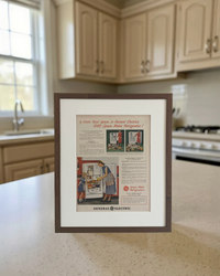 Original 1948 General Electric Space Maker Refrigerator vintage advertisement in a handcrafted walnut frame styled on a modern kitchen countertop.