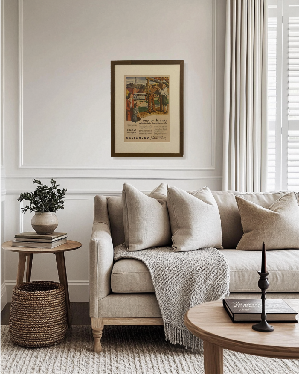 Original Greyhound travel advertisement from the 1940s framed in walnut brown and styled above a cozy reading chair.