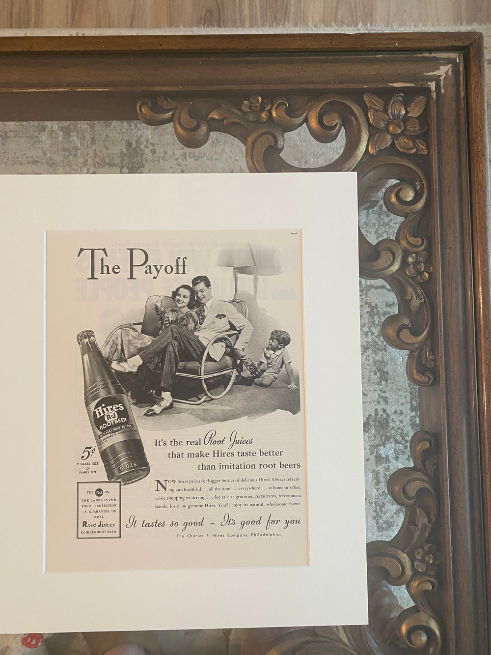 Close-up detail of the brass frame, off-white mat, and original 1941 Hires Root Beer magazine advertisement.