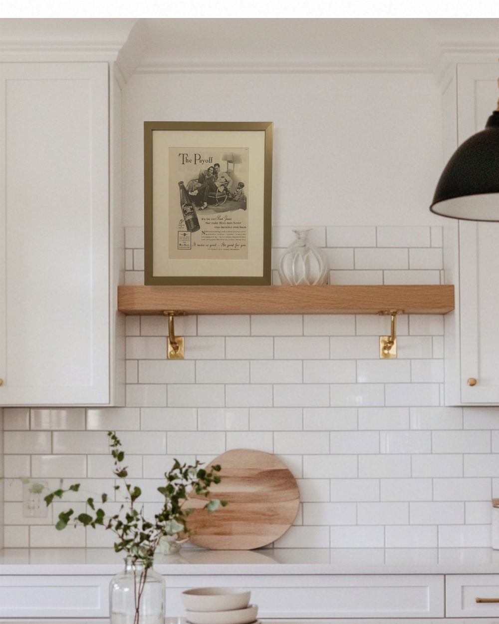 Original 1941 Hires Root Beer advertisement displayed on a floating kitchen shelf in a bright transitional kitchen.