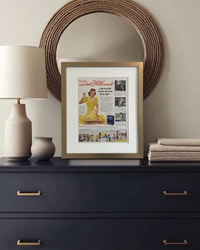 Original Ivory Flakes “Don’t You Want” vintage advertisement in a brushed brass frame styled on a dark dresser with neutral accessories.