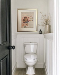Framed 1948 Max Factor Lana Turner vintage lipstick advertisement styled in a bright traditional powder room.