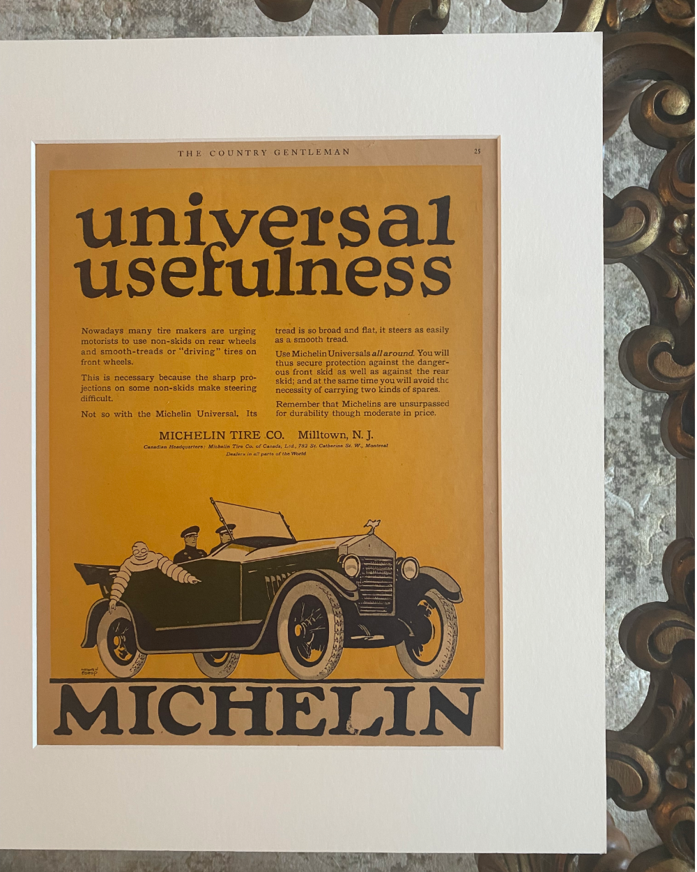 Close-up of the original Michelin “Universal Usefulness” vintage magazine advertisement with off-white mat, showing the preserved paper and artwork.