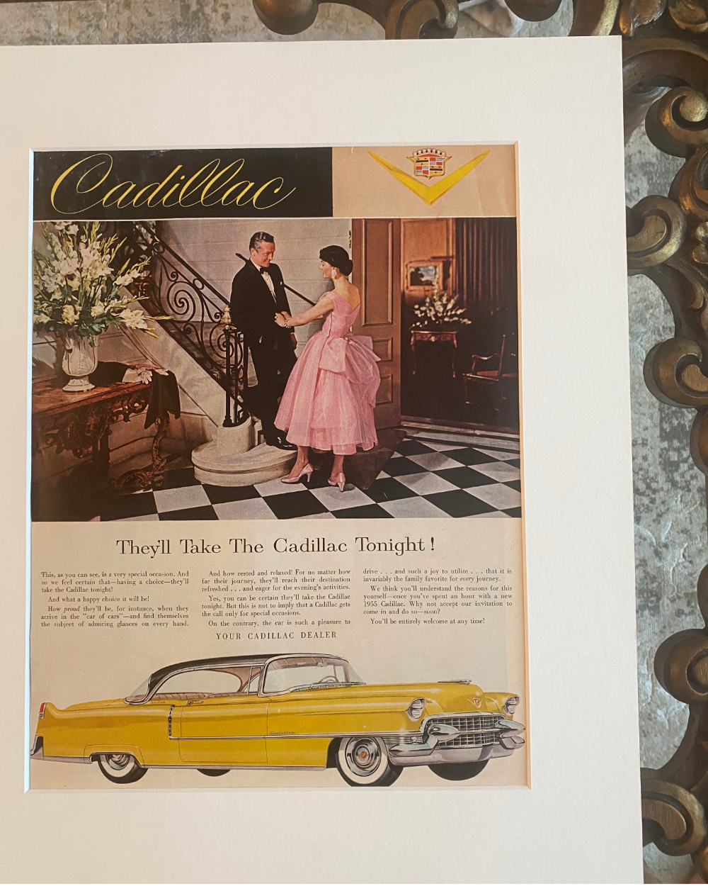 Close-up of the original 1955 Cadillac “They’ll Take the Cadillac Tonight!” vintage advertisement showing the artwork, typography, and preserved paper.