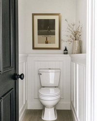 Original Calvert Extra “The Soft Whiskey” vintage advertisement framed in brass and displayed in a modern powder room.