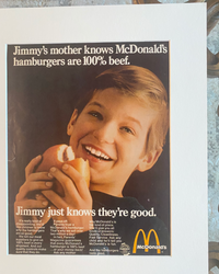 Close-up of the original McDonald’s “Jimmy’s Mother Knows Hamburgers Are 100% Beef” vintage advertisement showing the artwork, typography, and preserved paper quality.