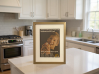 Original McDonald’s “Jimmy’s Mother Knows Hamburgers Are 100% Beef” vintage advertisement in a thin brass frame displayed on a modern kitchen countertop.