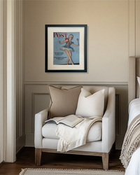 Original Saturday Evening Post ballerina cover in a black frame styled above a neutral bedroom reading nook