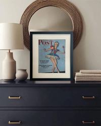 Original vintage Saturday Evening Post ballerina cover beautifully framed in black and styled on a dark dresser