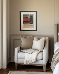Original vintage Avis automotive advertisement in a matte black frame styled above a bedroom reading nook