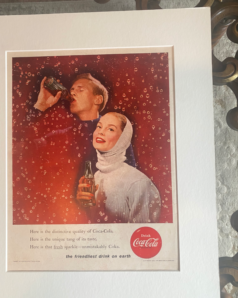 Original vintage Coca-Cola magazine advertisement featuring a couple surrounded by sparkling bubbles and classic Coke bottles
