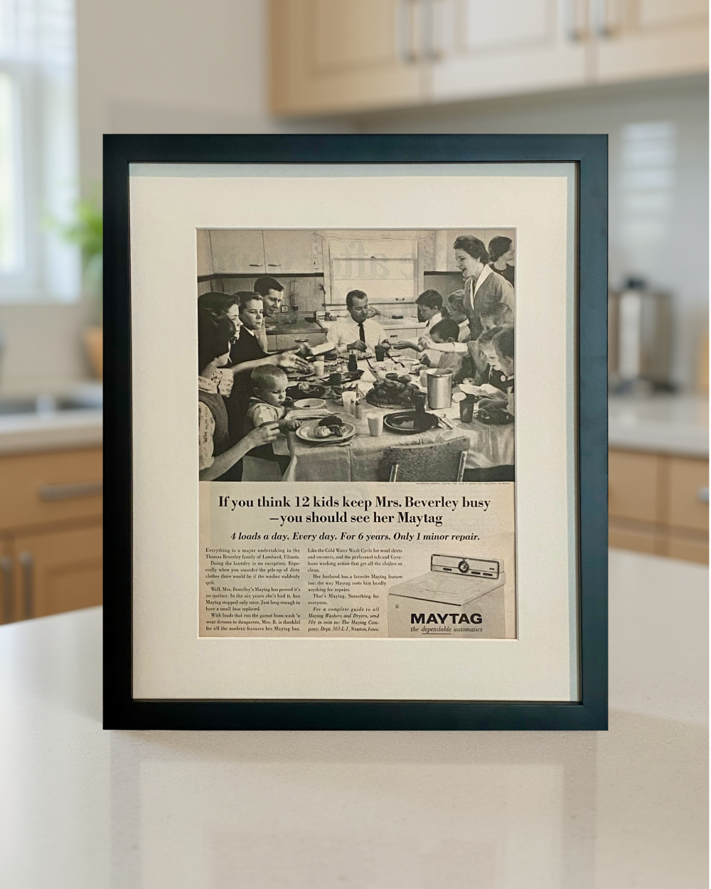 Original 1965 Maytag vintage magazine advertisement beautifully framed in black and styled on a modern kitchen counter