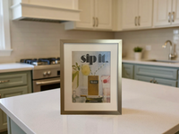 Original vintage Winston Menthol advertisement beautifully framed in brushed brass and styled on a modern kitchen counter.