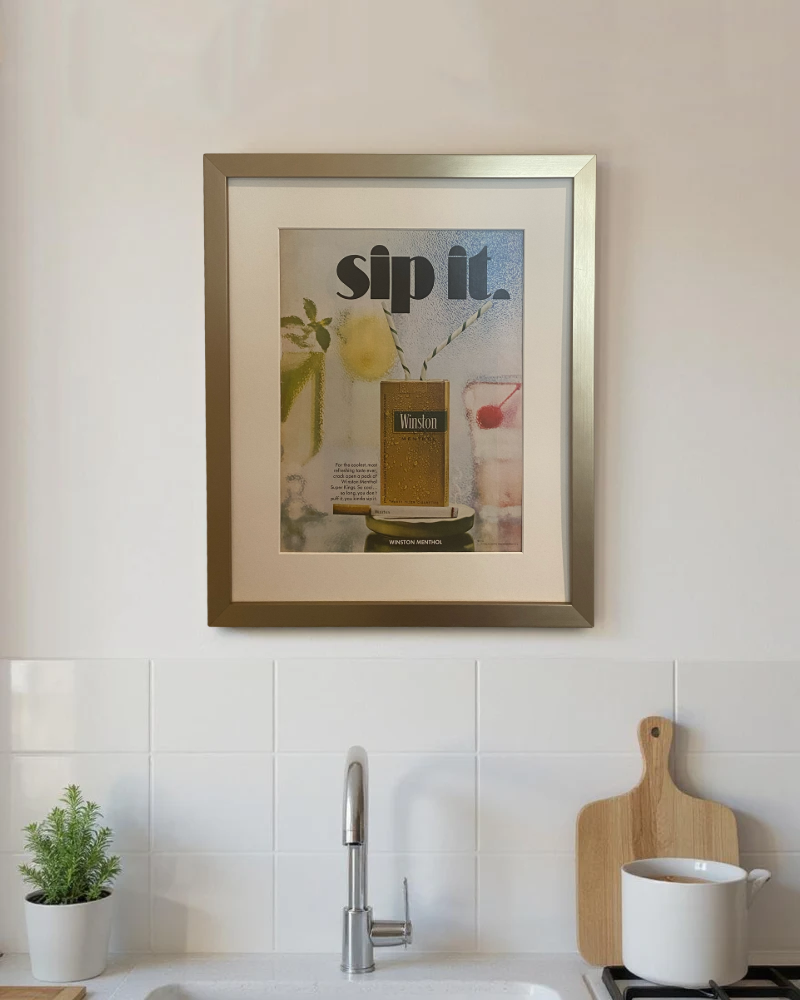 Original vintage Winston Menthol advertisement beautifully framed in brushed brass and displayed above the counter in a modern kitchen