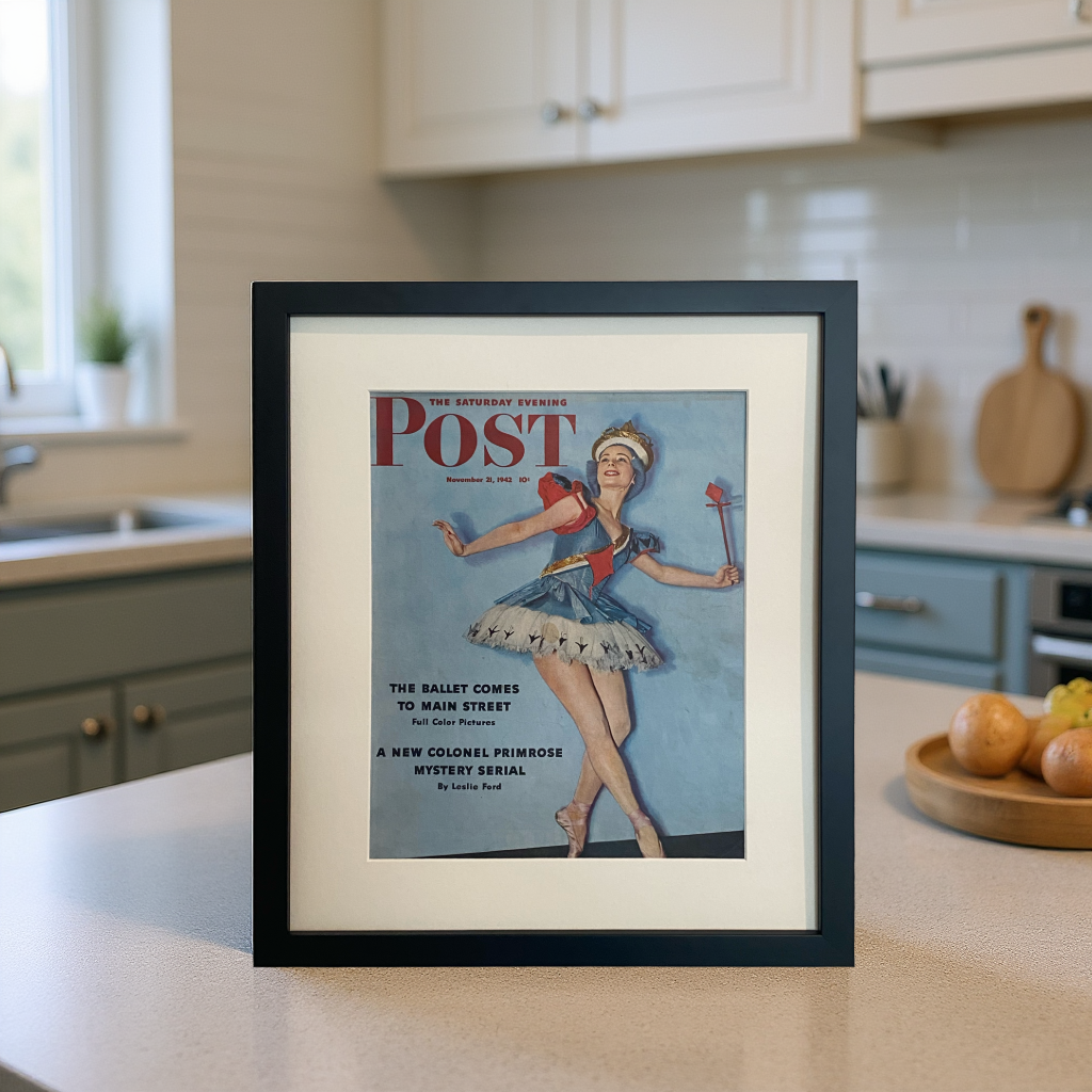 Original 1942 Saturday Evening Post ballerina cover beautifully framed in black with an off-white mat, styled on a modern kitchen counter.