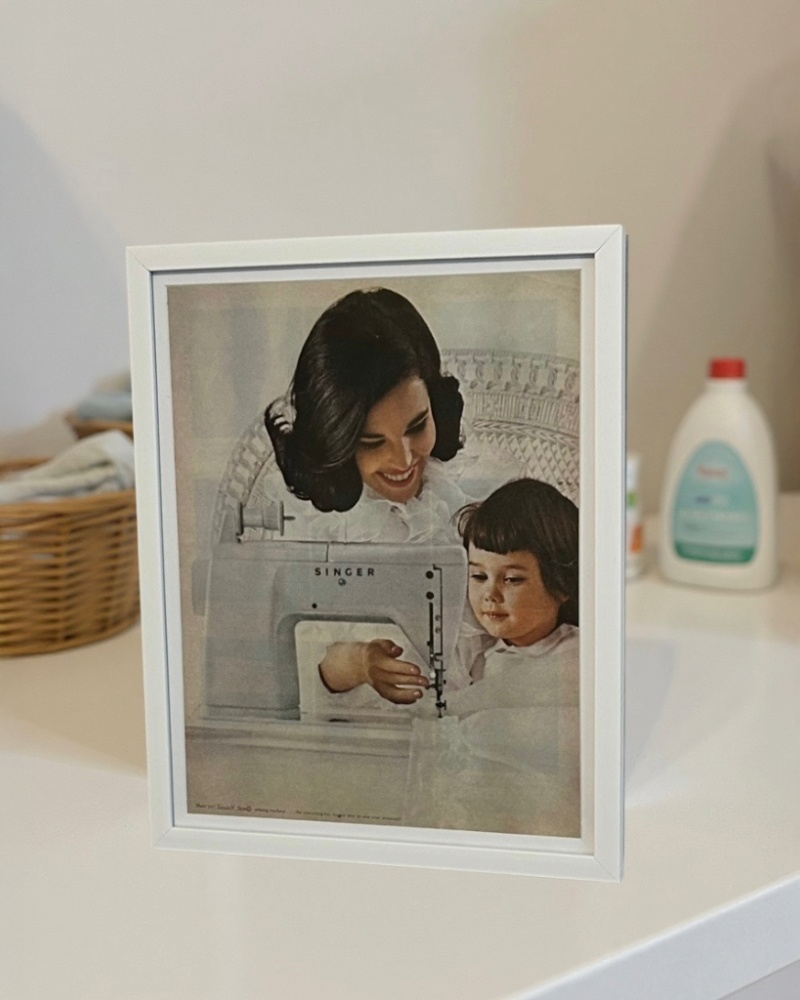 Modern vintage Singer sewing machine advertisement featuring mother and daughter, framed mid-century print
