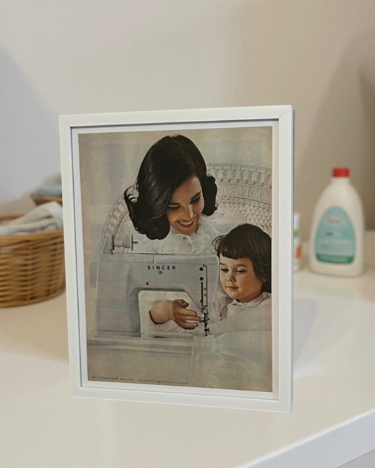 Modern vintage Singer sewing machine advertisement featuring mother and daughter, framed mid-century print