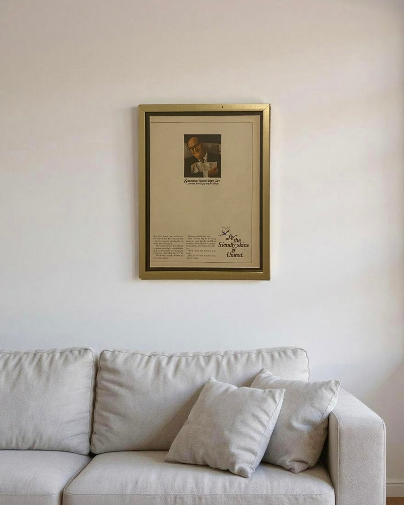 Framed vintage United Airlines Fly the Friendly Skies original magazine advertisement styled in a neutral living room and bedroom setting