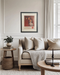 Original framed vintage Coca-Cola advertisement adding rich red color to a neutral modern living room
