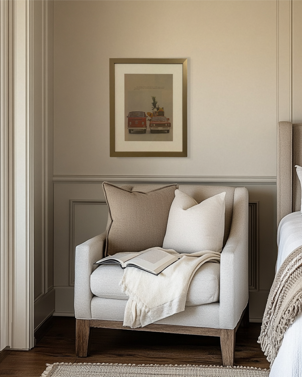 Original framed Volkswagen “176 Cubic Feet” vintage magazine advertisement displayed above a cozy bedroom reading nook with neutral modern decor.